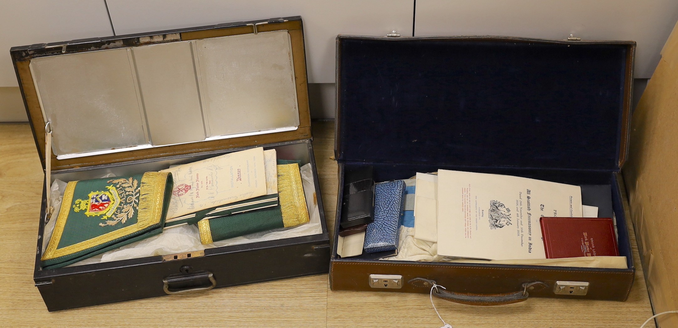 A collection of Masonic medals, cuffs and ephemera and, a W Masjid-1, Suleman Lodge Banquet menu autographed on the front cover and Proceedings of The Grand Lodge Bombay 1939, together in two suitcases